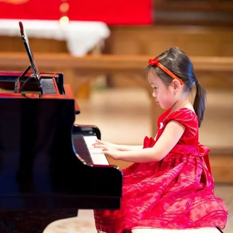 Student performing at an Opus 1 Music Studio piano recital